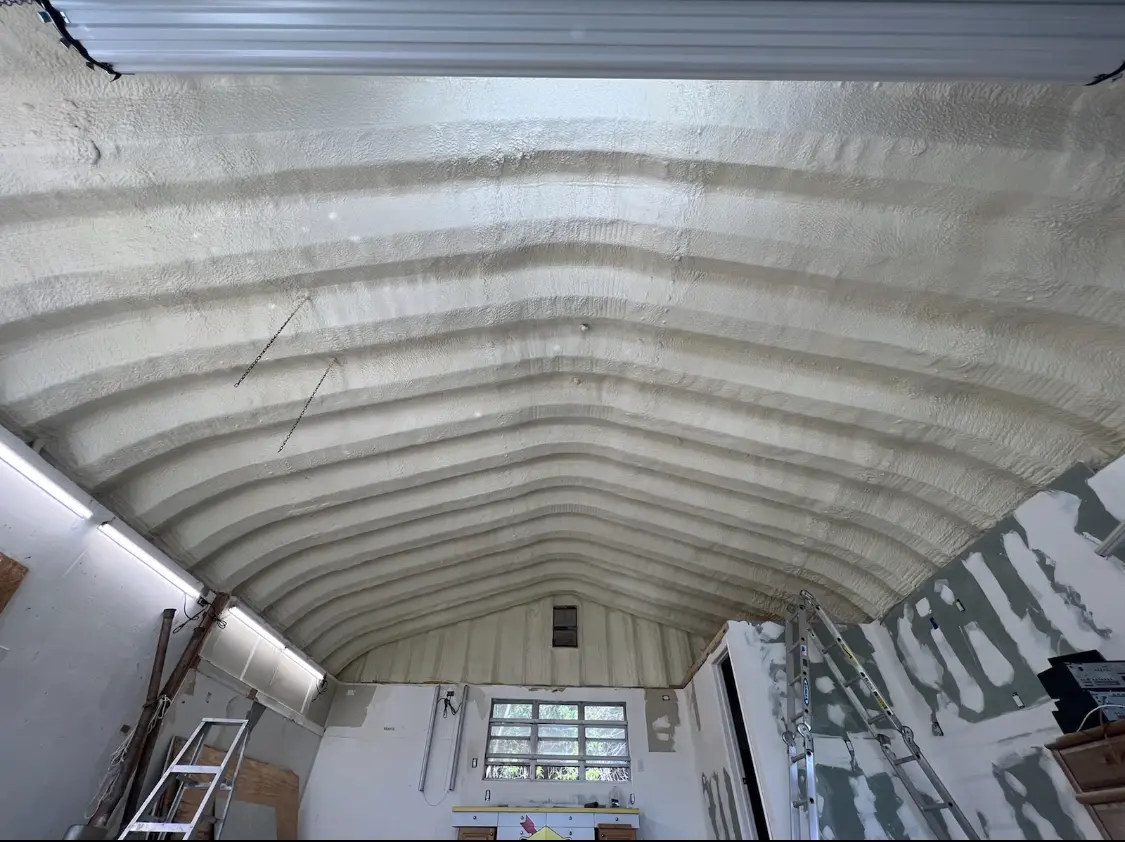 Spray polyurethane foam applied to the underside of a metal roof deck in Hanover